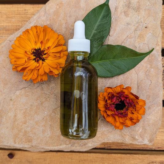 herbal body oil with calendula, comfrey, chickweed and chamomile