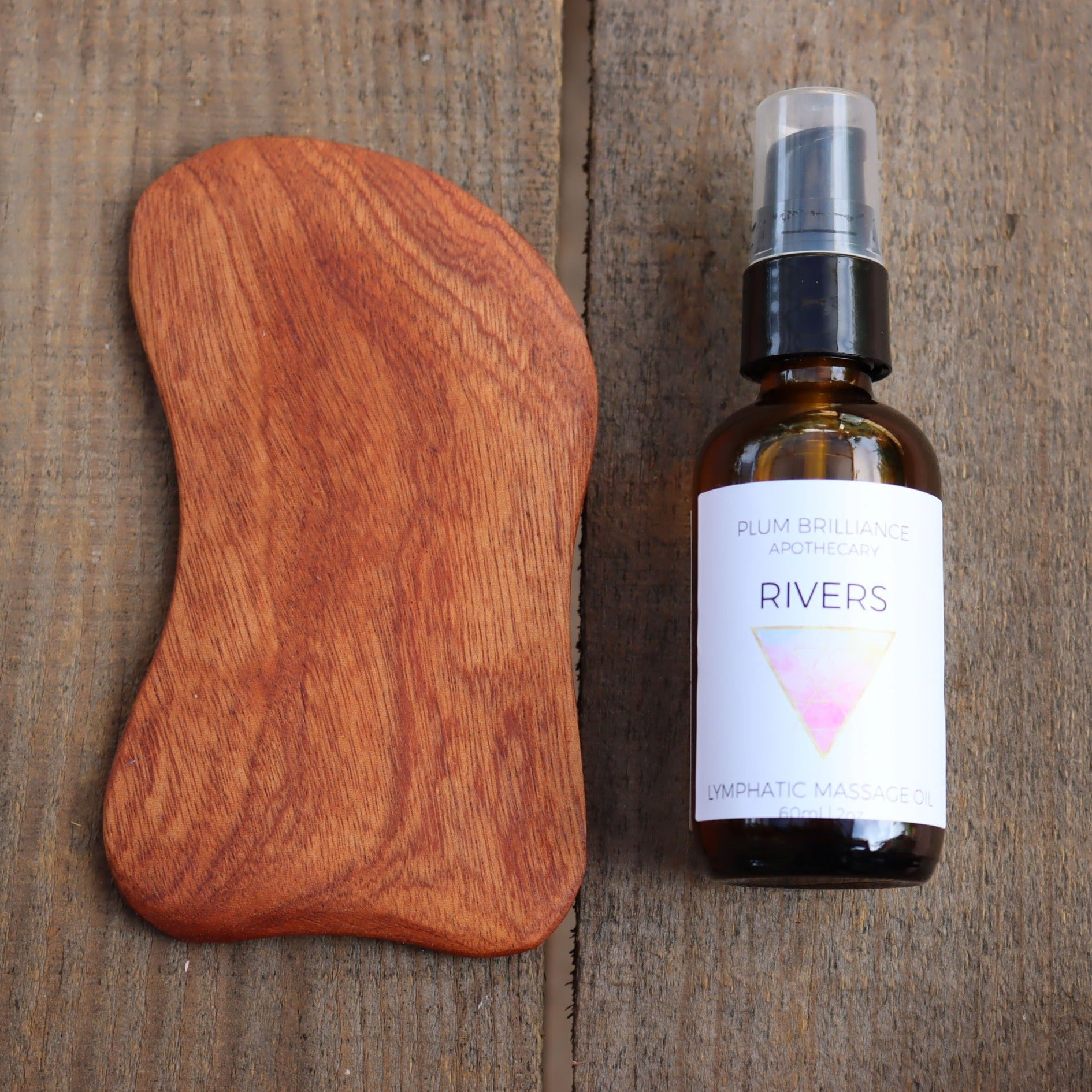 cherry wood gua sha tool and ocotillo lymphatic massage oil