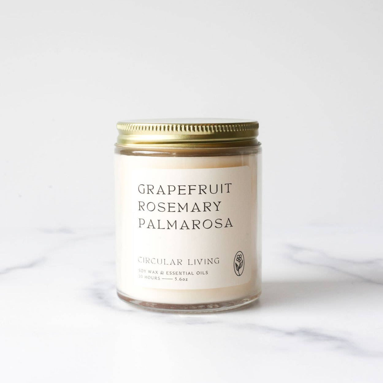 grapefruit rosemary palmarosa essential oil candle in glass