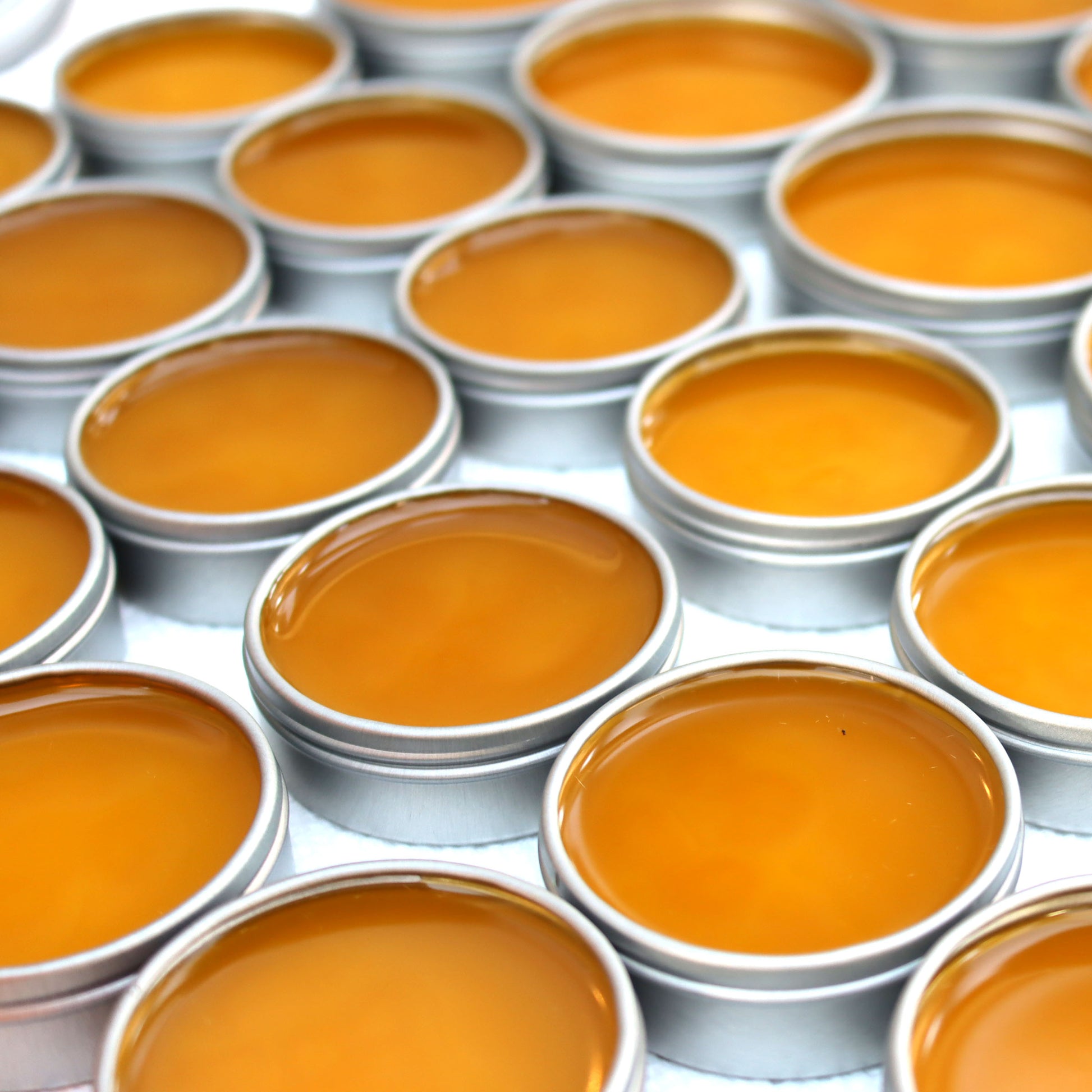 just poured tins of warming salve handcrafted in San Diego county